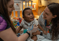 two nurses with baby