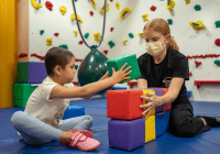 Occupational Therapist working with patient