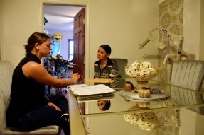 mom and health home care worker in living room