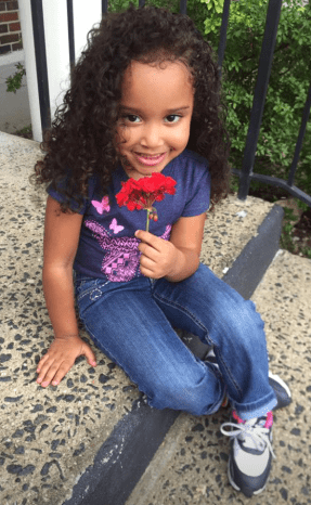 little girl with flower