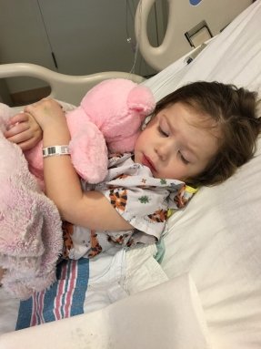 little girl in hospital bed