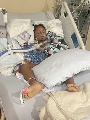 child in a hospital bed