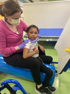 child turning her head during therapy