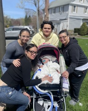 child outside with family