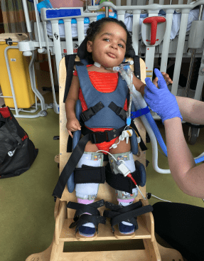 child in a stander