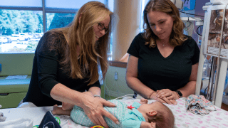 therapist with mother and baby