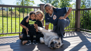 two mothers with baby and dog