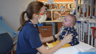 Baby with occupational therapist
