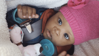 baby with snow hat