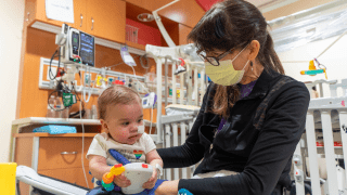 physical therapist with baby