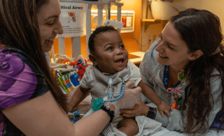 two nurses with baby