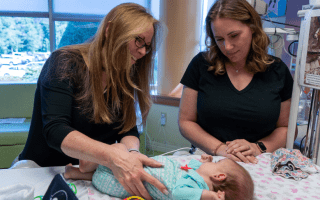 therapist with mother and baby