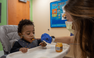 baby eating purees from speech therapist