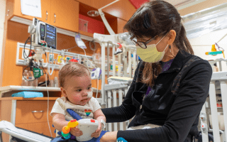 physical therapist with baby