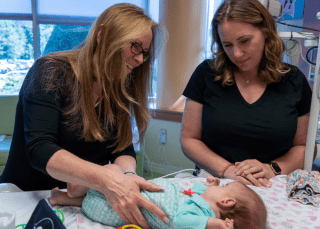 therapist with mother and baby