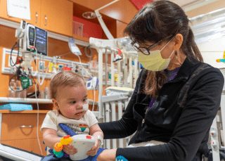 physical therapist with baby
