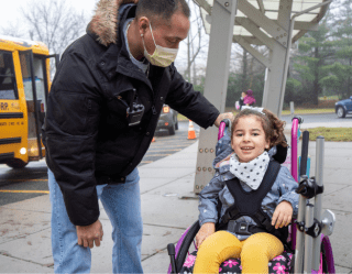 girl in wheelchair coming off school bus