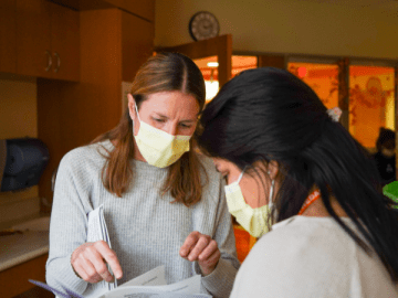 social worker and mom going over paperwork