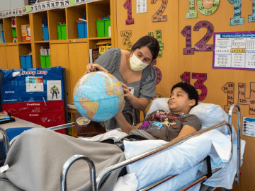 child in school with teacher