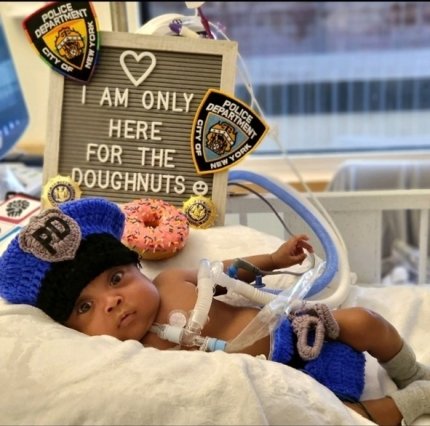 baby dressed as a cop