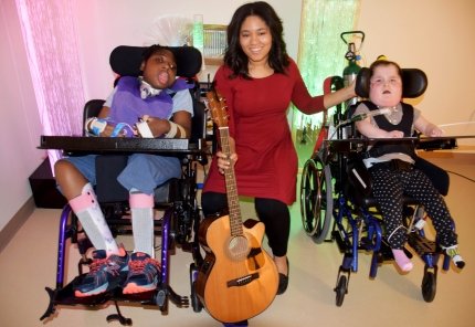 Music Therapist with two children in wheelchairs