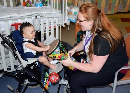 music therapist playing with baby