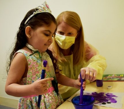 child working with occupational therapist