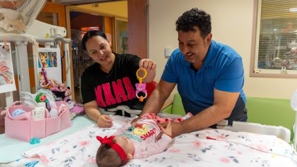 Parents playing with baby