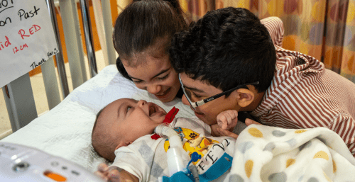 baby with brother and sister