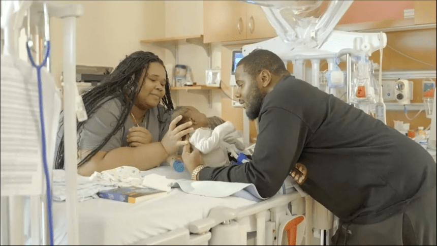 two parents with baby