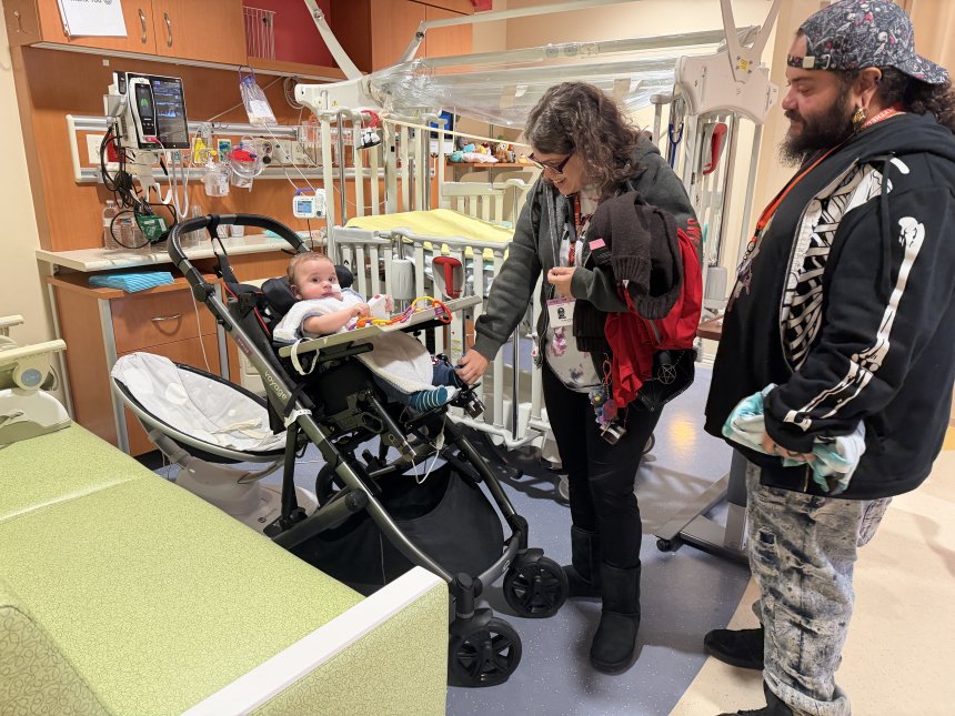 parents with a baby in a medical center